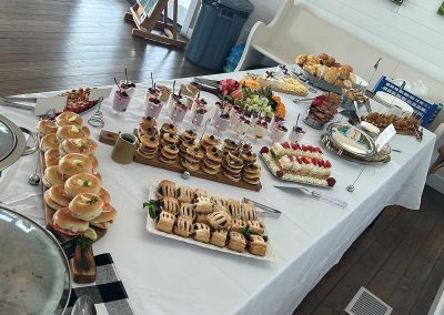 Brunch table including bagels hot items
