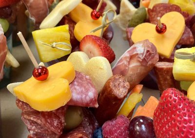 Charcuterie in cups with cheese hearts